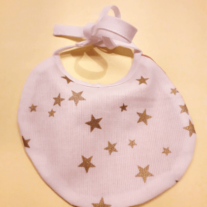 Bavoir poupée étoiles dorées