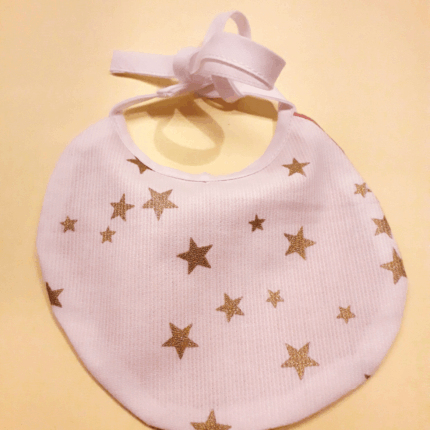 Bavoir poupée étoiles dorées