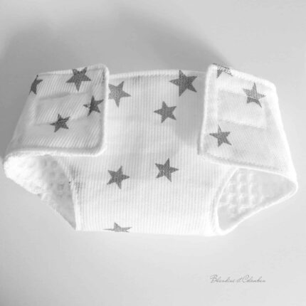 Couche poupée étoiles argentées