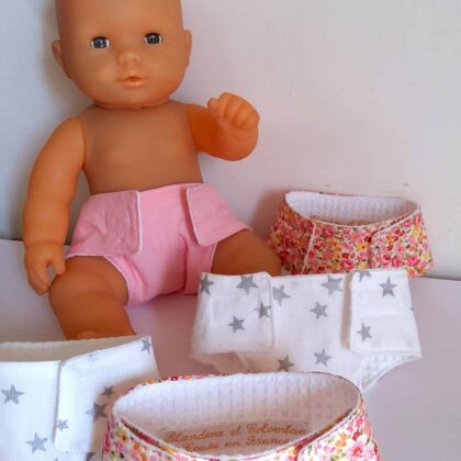 Couche poupée rose et blanche